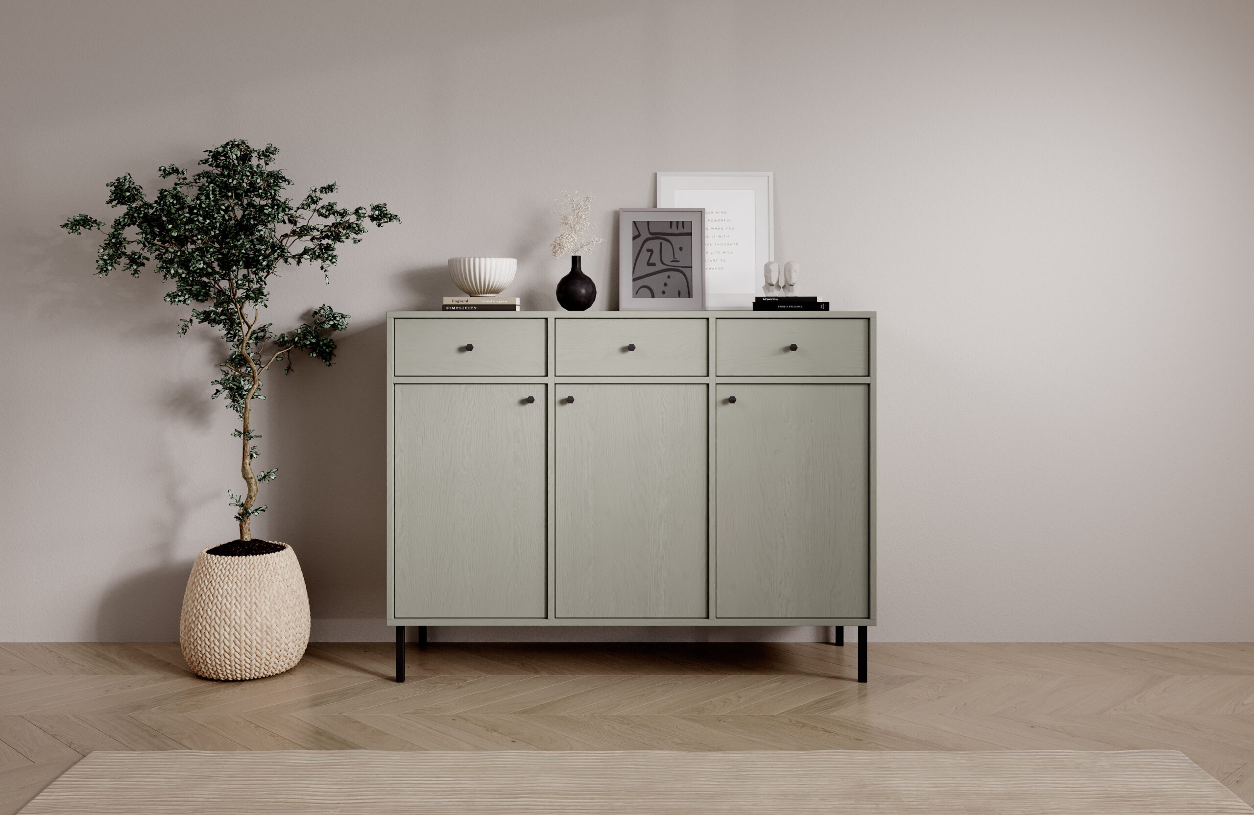 Modern zöld komód letisztult nappaliban, fekete lábakkal és dekorációval a tetején